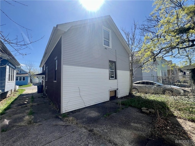 view of property exterior featuring fence