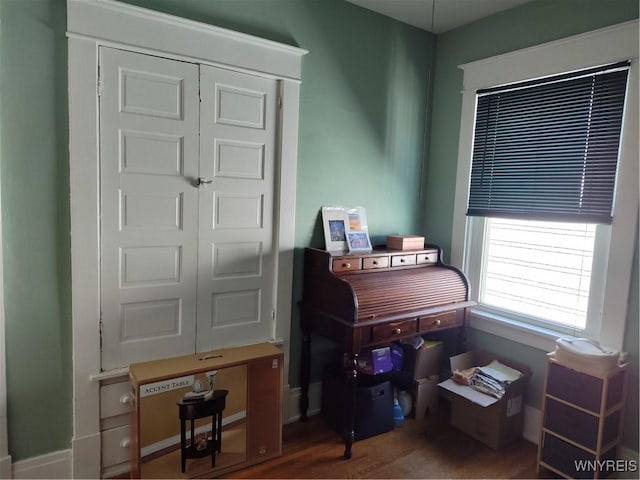 office space with wood finished floors