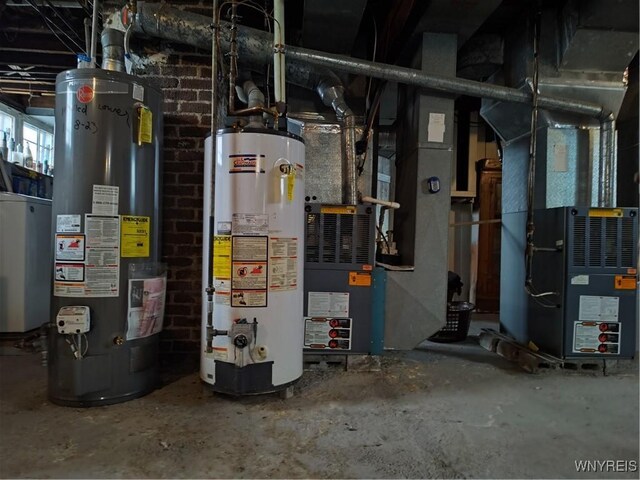 utility room with heating unit and water heater