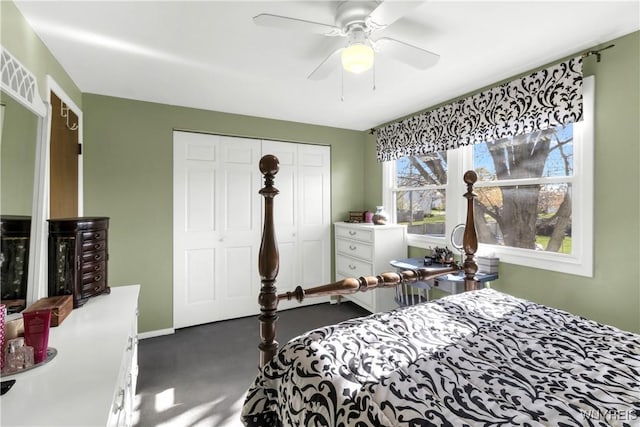 carpeted bedroom with baseboards, ceiling fan, and a closet