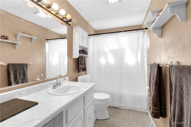 bathroom featuring toilet, curtained shower, and vanity