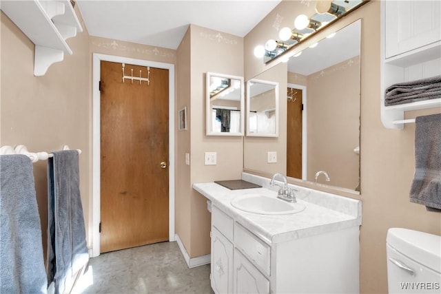 bathroom with vanity and toilet