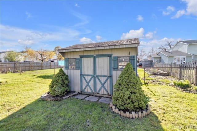 view of shed with a fenced backyard