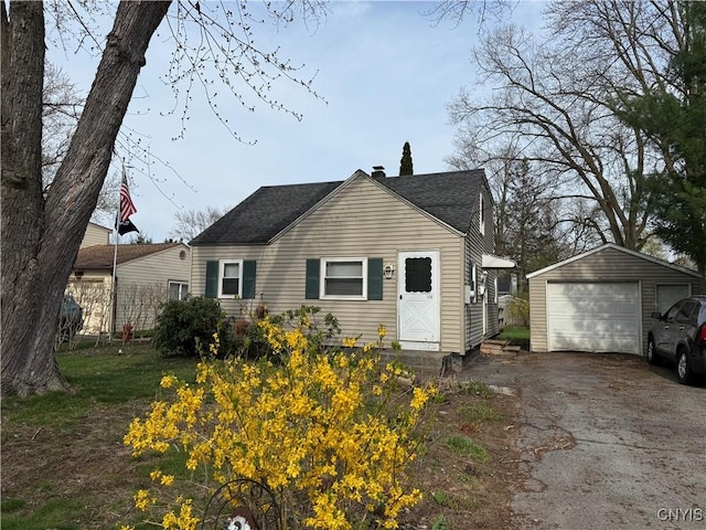 125 Maple Manor Dr, Clay, NY 13212 - exterior space with a garage, an outbuilding, driveway, and roof with shingles