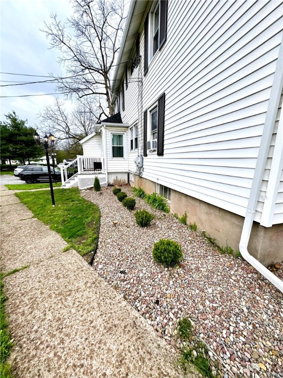 view of side of property featuring cooling unit