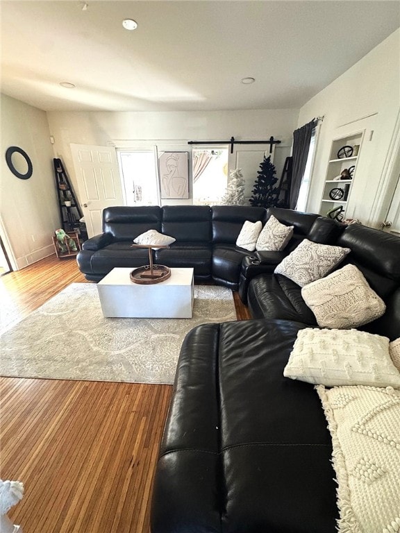 living room with recessed lighting and wood finished floors