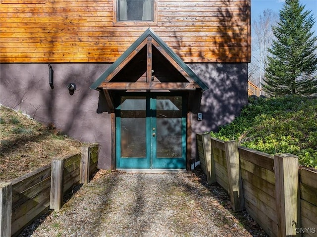 doorway to property with fence