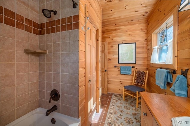 bathroom with tile patterned flooring, vanity, and shower / washtub combination