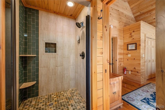 full bathroom with wood ceiling, wood finished floors, and a tile shower