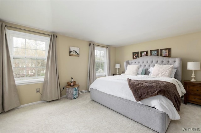 bedroom with carpet floors and baseboards