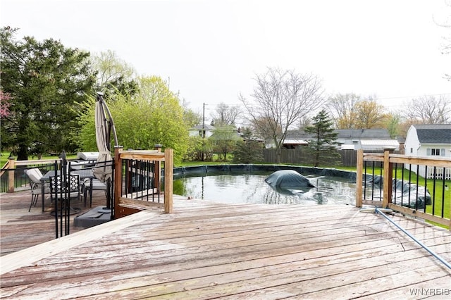 deck featuring fence and outdoor dining space