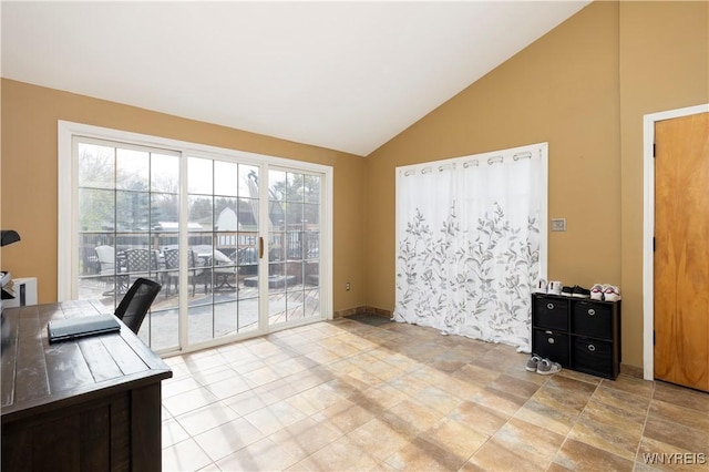 office with high vaulted ceiling and stone finish floor