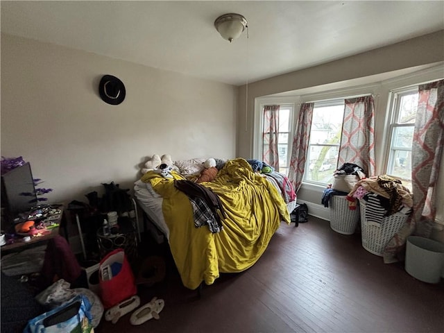 bedroom with hardwood / wood-style floors