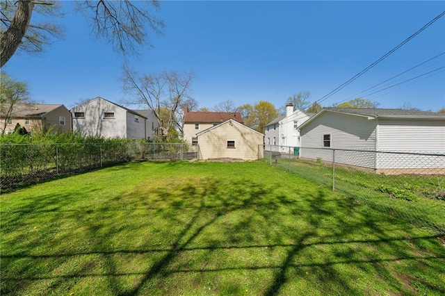 view of yard featuring a residential view and a fenced backyard