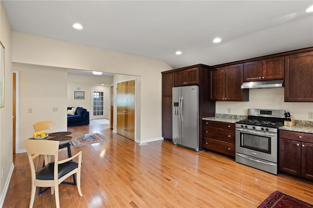 kitchen with light wood-style flooring, under cabinet range hood, dark brown cabinets, and stainless steel appliances
