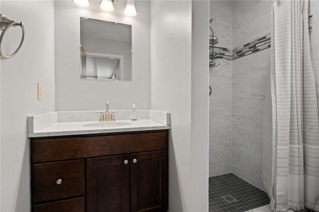 bathroom featuring vanity and a shower stall