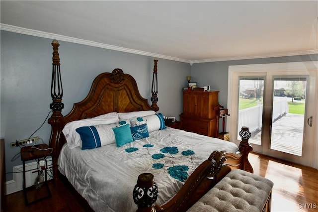bedroom with access to outside, ornamental molding, and wood finished floors