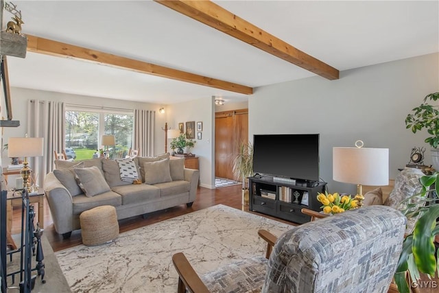 living room featuring beam ceiling and wood finished floors