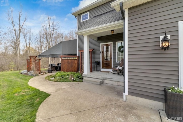 property entrance with a yard