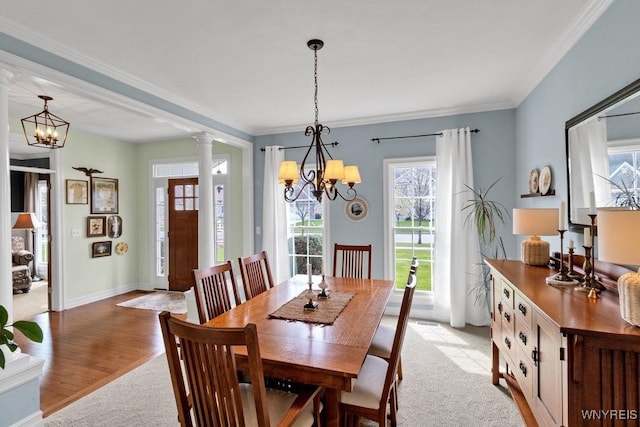dining space featuring a chandelier and a healthy amount of sunlight