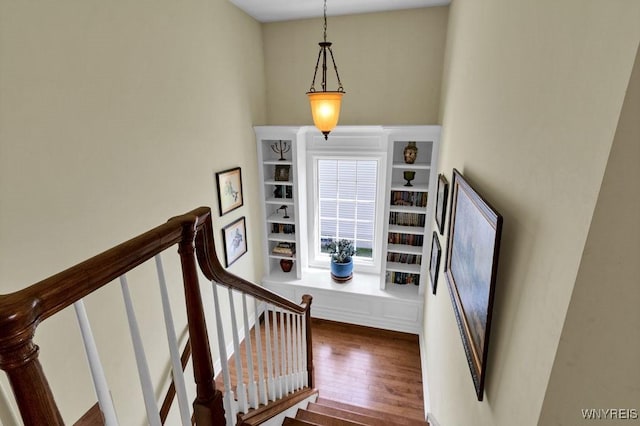 stairs with wood finished floors