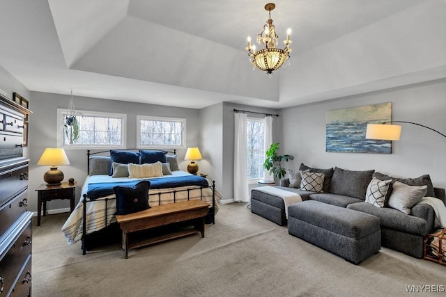 bedroom with carpet flooring and a notable chandelier