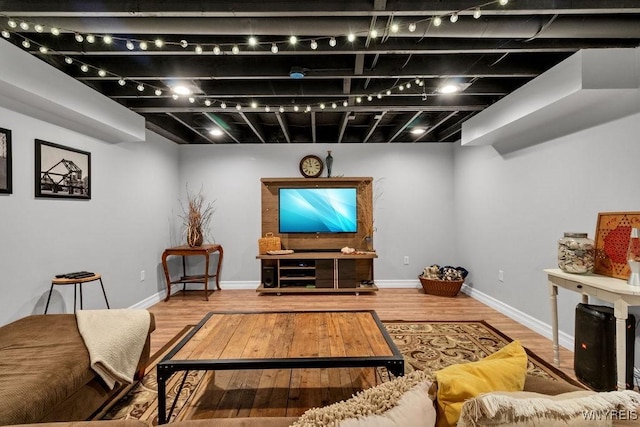 living room featuring baseboards and wood finished floors
