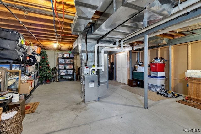 unfinished basement with heating unit