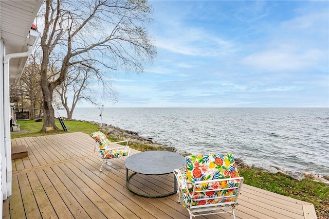 exterior space with a deck with water view