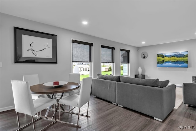 living area featuring recessed lighting, dark wood-style flooring, and baseboards