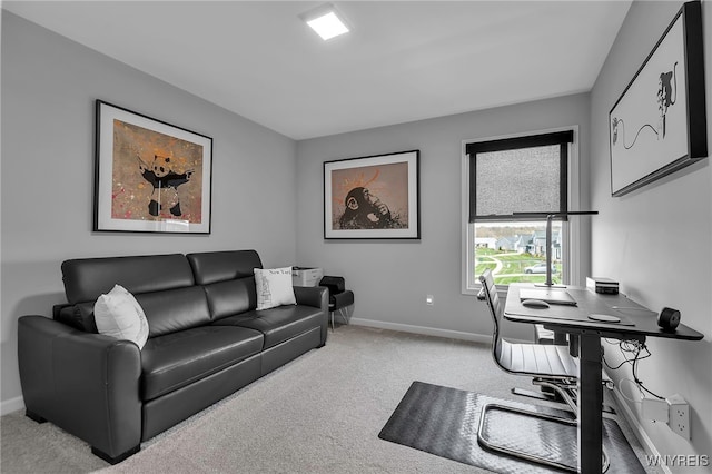 carpeted office featuring baseboards