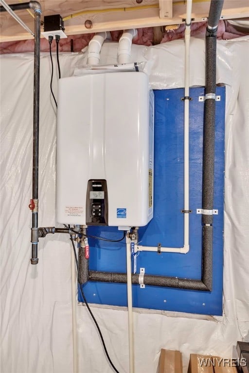 utility room with tankless water heater