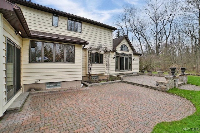 rear view of property with a patio