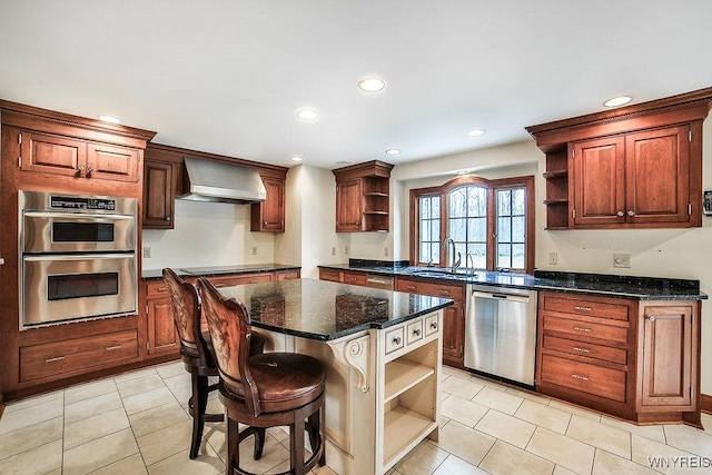 kitchen with wall chimney range hood, appliances with stainless steel finishes, open shelves, light tile patterned floors, and a sink