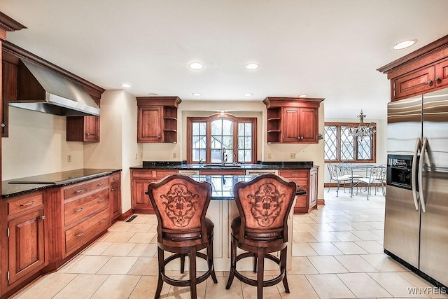 kitchen featuring open shelves, black electric stovetop, wall chimney exhaust hood, light tile patterned floors, and stainless steel refrigerator with ice dispenser