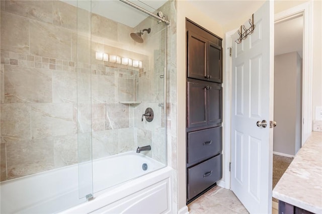 bathroom featuring vanity and shower / bath combination with glass door