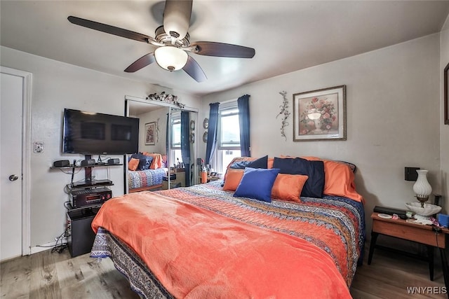 bedroom with a ceiling fan and wood finished floors