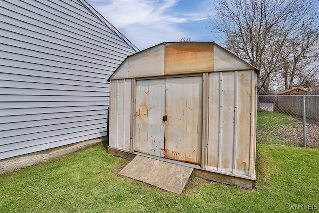 view of shed with fence