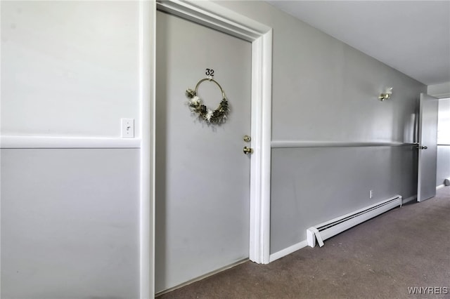 entrance to property with a baseboard heating unit