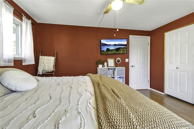 bedroom with a ceiling fan and wood finished floors