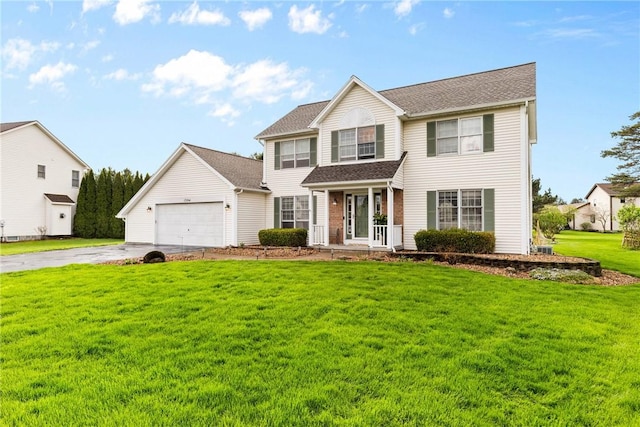 view of front facade featuring a garage, a front lawn, covered porch, and concrete driveway