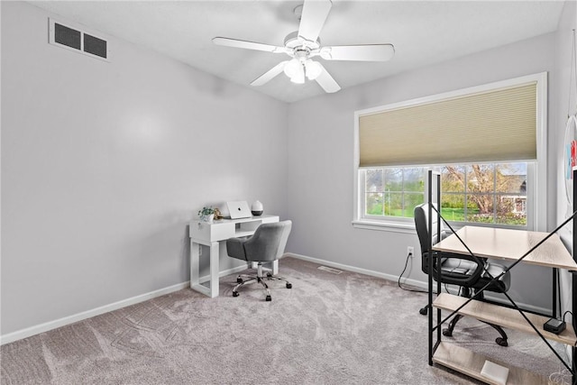 office area featuring visible vents, a ceiling fan, baseboards, and carpet floors