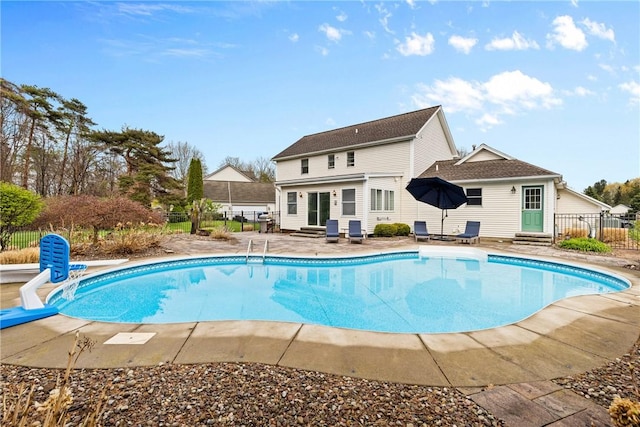 view of swimming pool with a fenced in pool, fence, a patio, and entry steps
