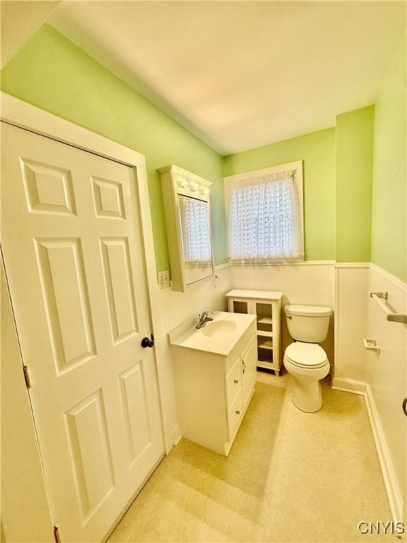 bathroom with toilet and vanity