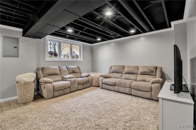 living area featuring electric panel and wood finished floors