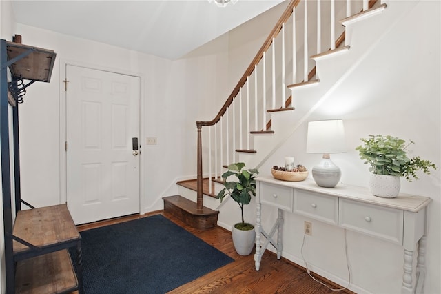entryway with stairway and wood finished floors