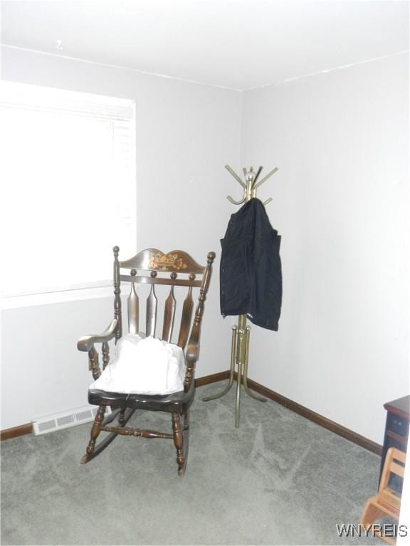 sitting room featuring carpet floors, baseboards, and visible vents