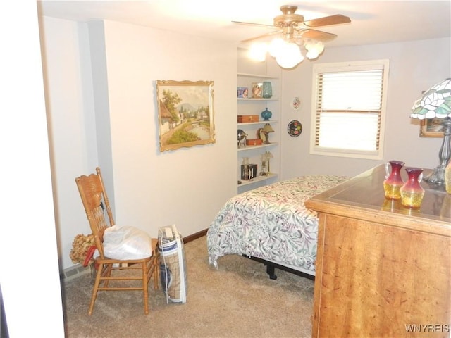 bedroom with ceiling fan and carpet