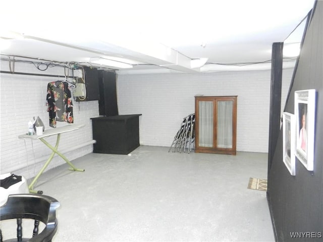 finished basement with brick wall