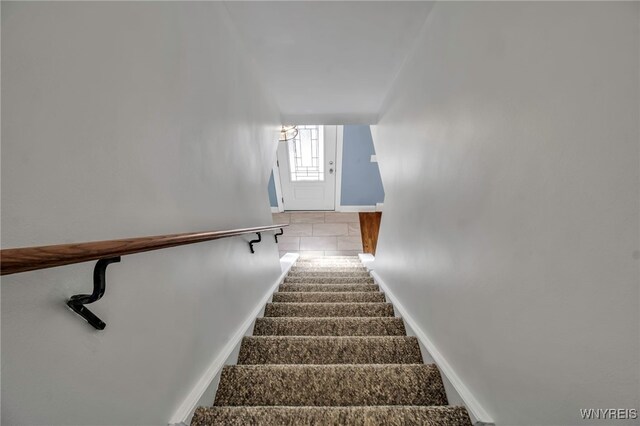 stairs featuring baseboards